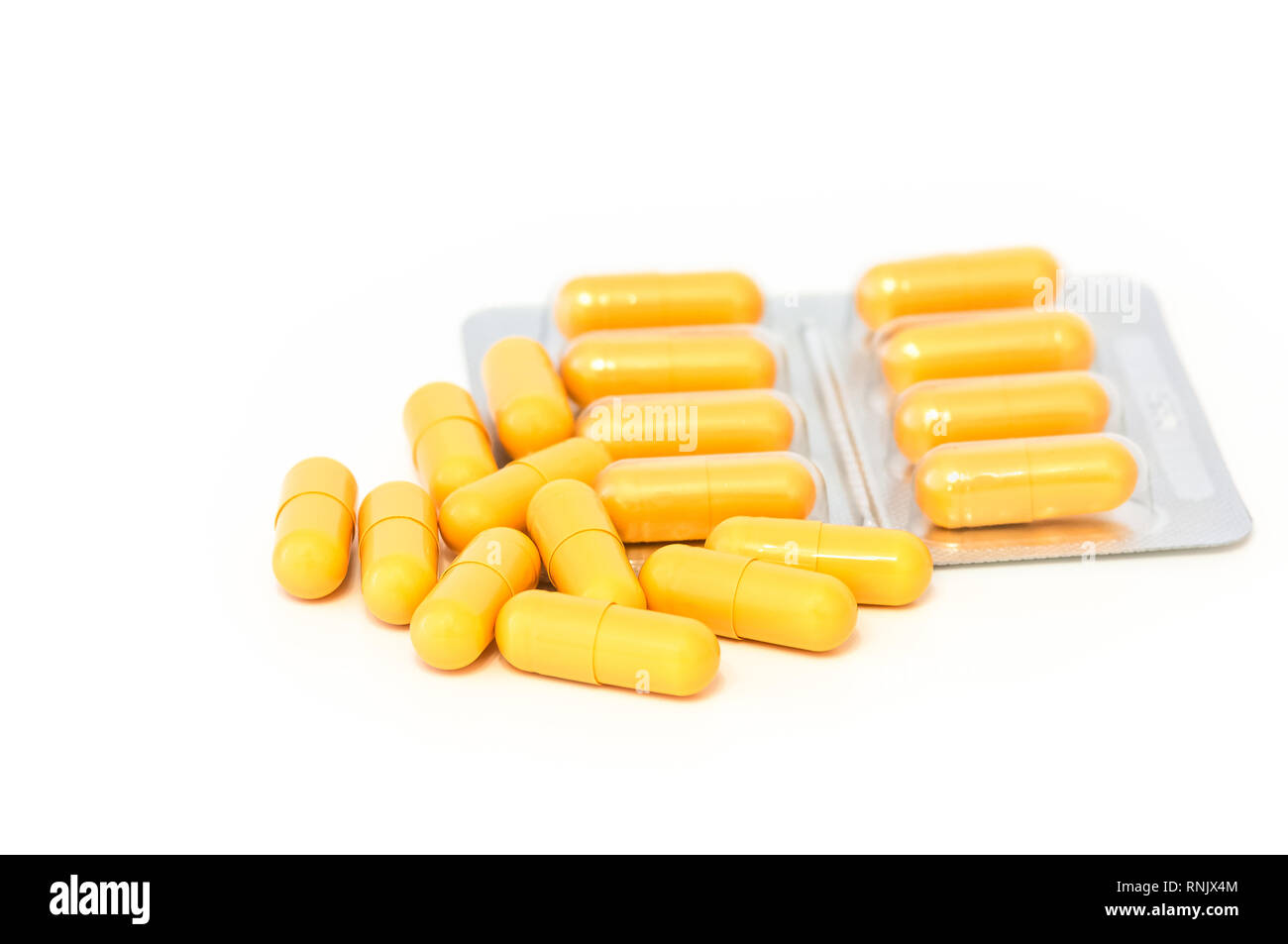 Download Bright Yellow Pills And Blisters Scattered On A White Background Isolated Stock Photo Alamy PSD Mockup Templates