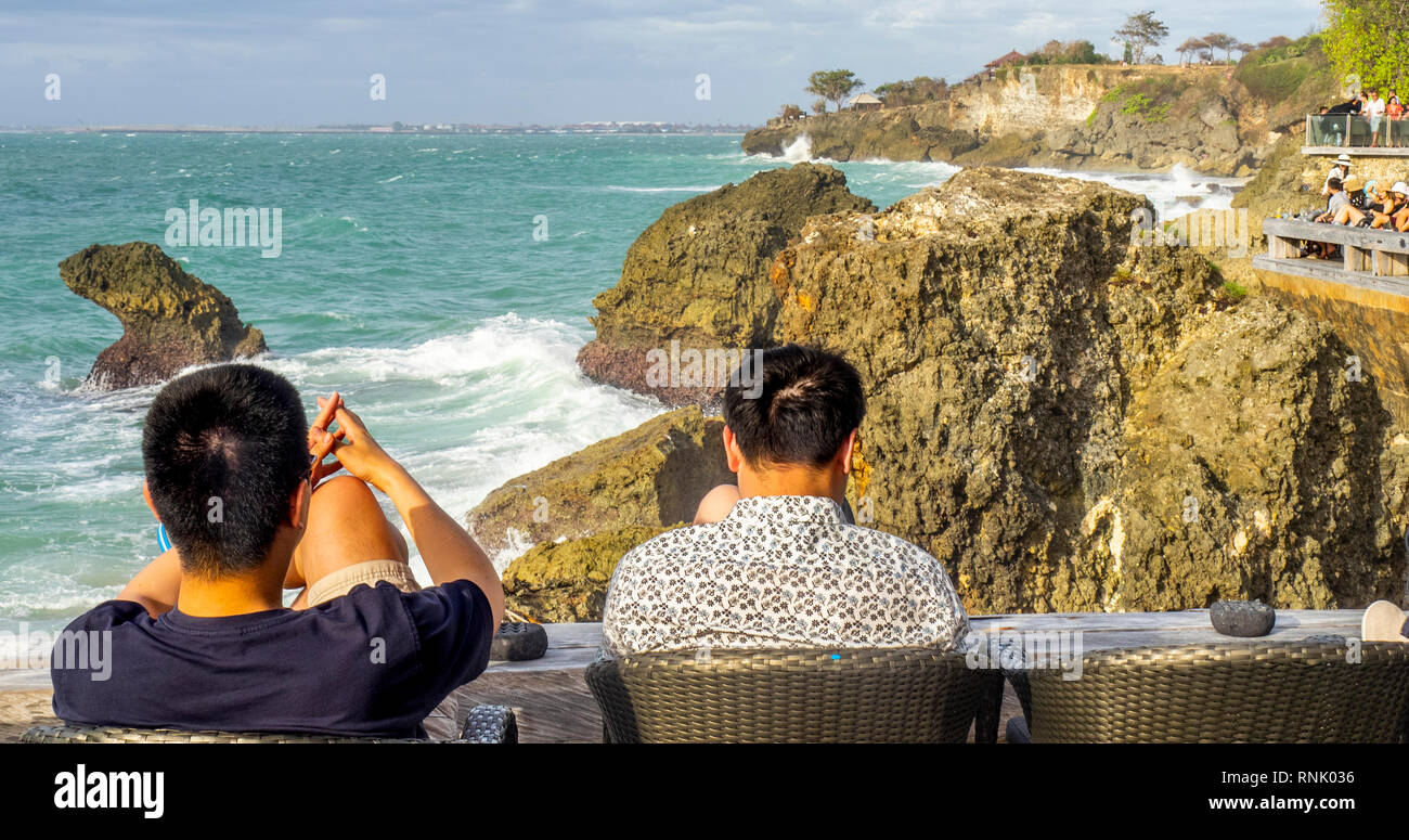 Two Chines Male Tourists At The Rock Bar At Ayana Resort And Spa Jimbaran Bali Indonesia Stock Photo Alamy