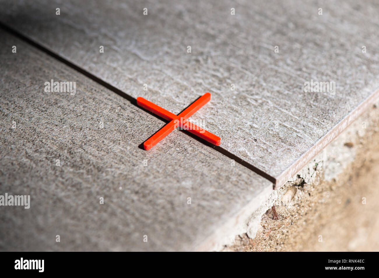 Installing floor tiles at home Stock Photo Alamy