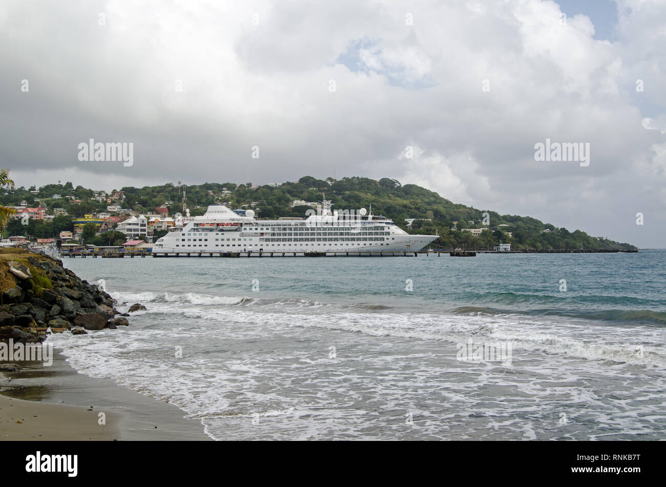 SCARBOROUGH, TRINIDAD AND TOBAGO - JANUARY 11, 2019:  View across the main bay at Scarborough with the cruise ship Silver Wind docked in the deep wate Stock Photo