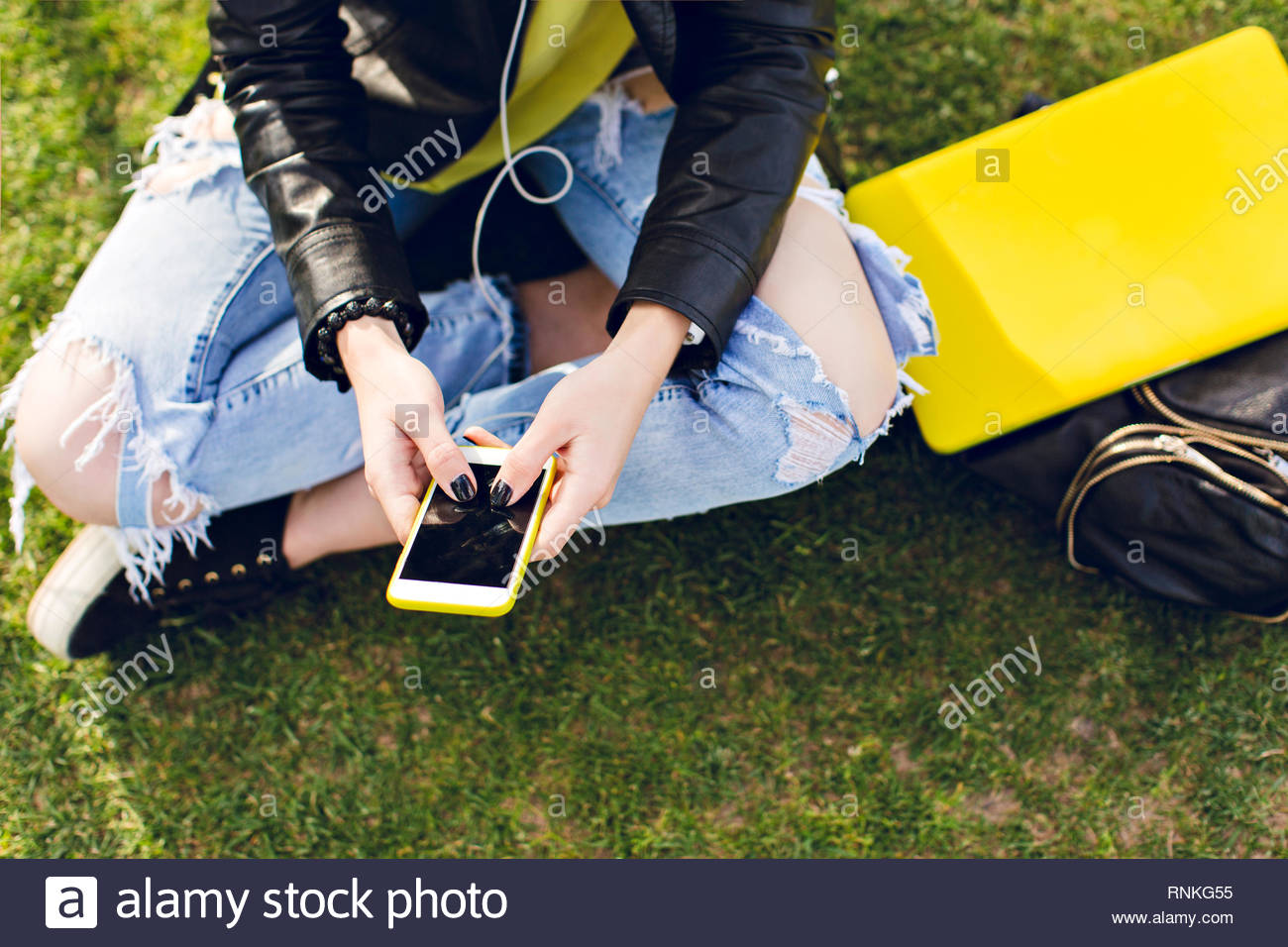 black and yellow ripped jeans
