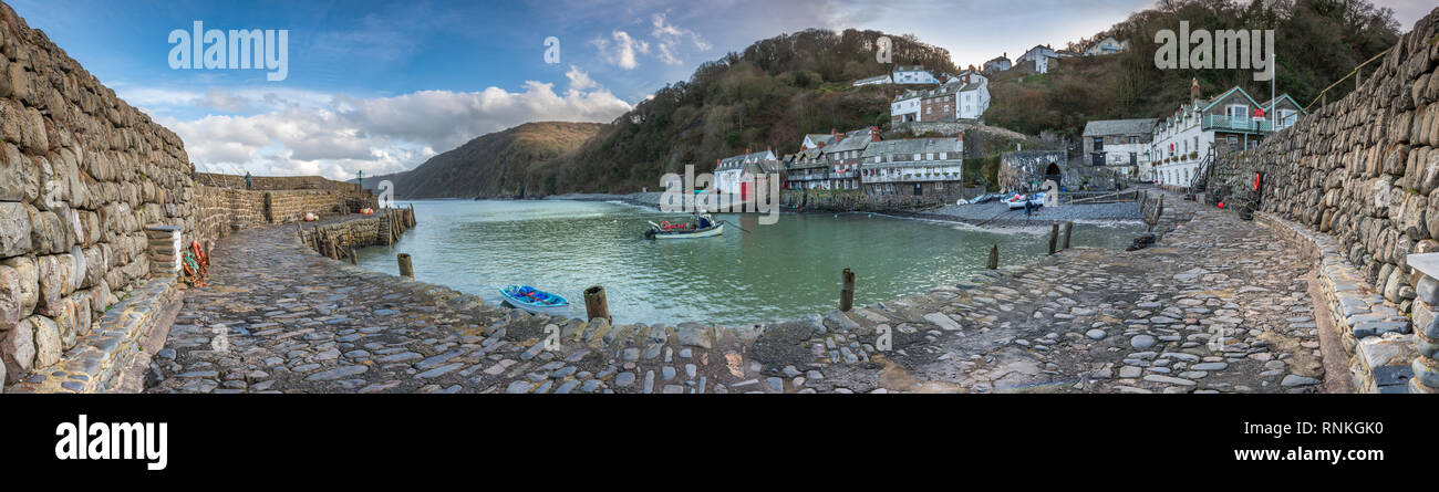 The historic little working fishing  harbour sits at the foot of the steep climb into the cobbled main street of Clovelly overlooking Bideford Bay in  Stock Photo