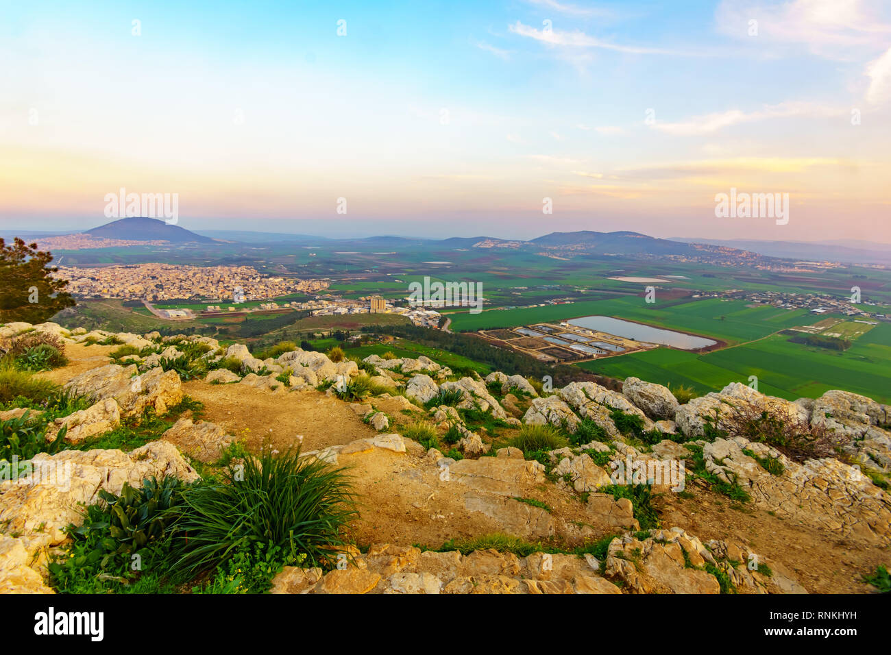 Sunset view of the Jezreel Valley and Mont Tabor, from Mount Precipice. Israel Stock Photo