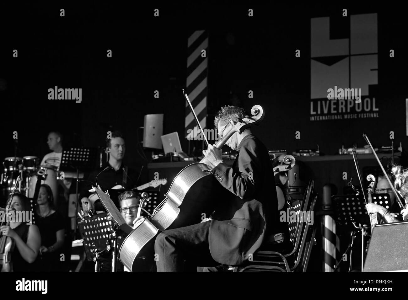 Monochrome image of Hacienda Classical performing live on stage at the
