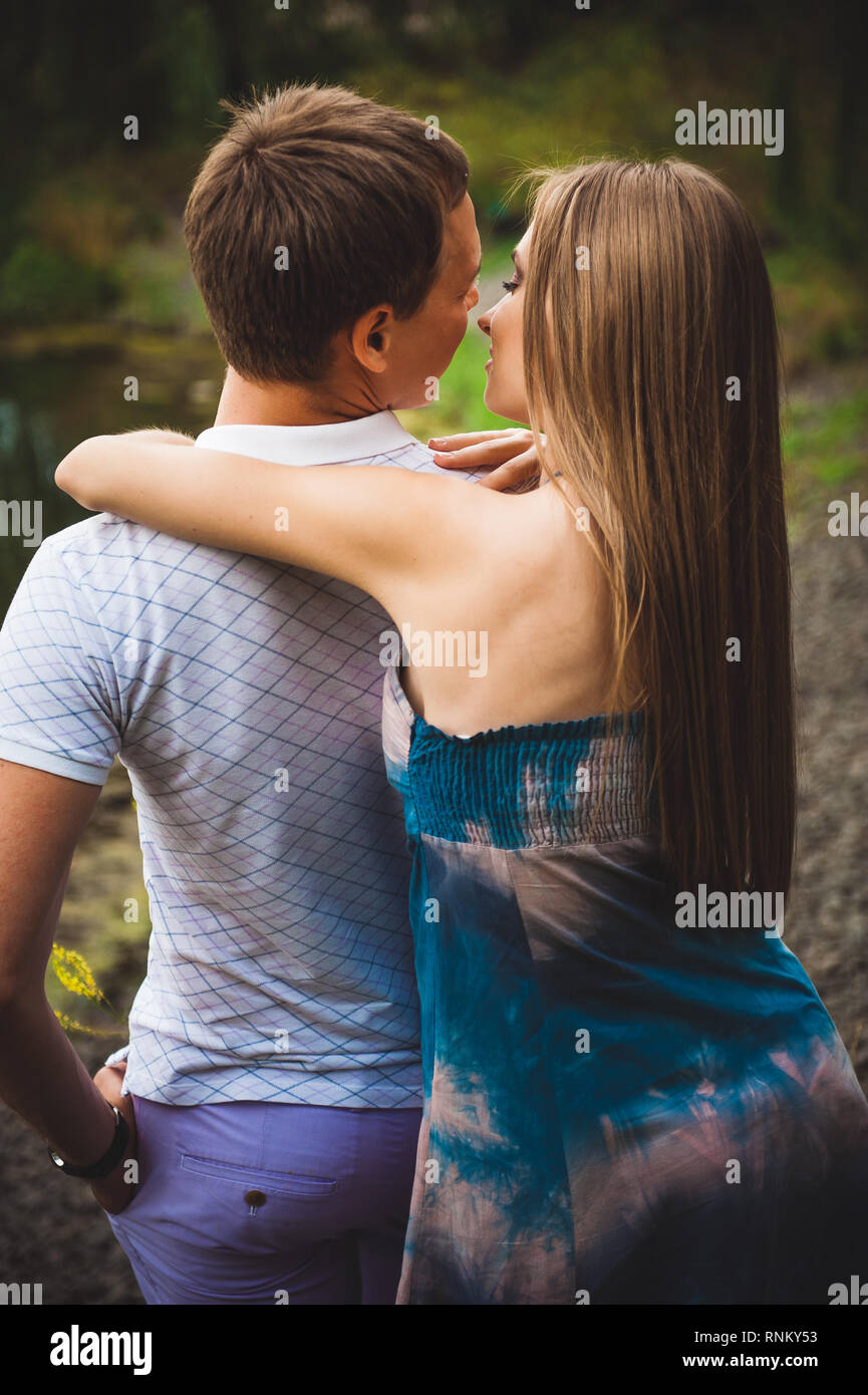 Pregnant woman with her husband in the park Stock Photo - Alamy