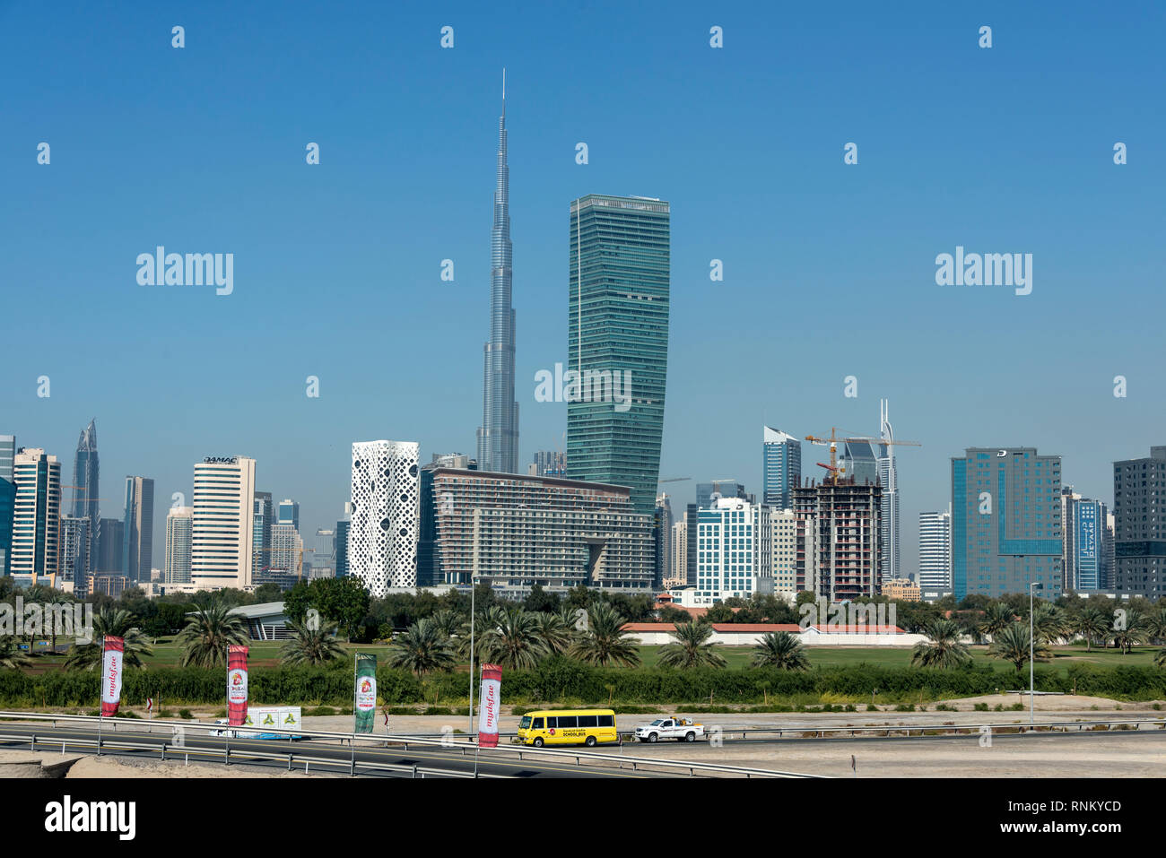 Skyline of downtown Dubai including the tall kilometre high metal structure of the Burj Khalifa, known as the Burj Dubai in downtown Dubai in Dubai in Stock Photo