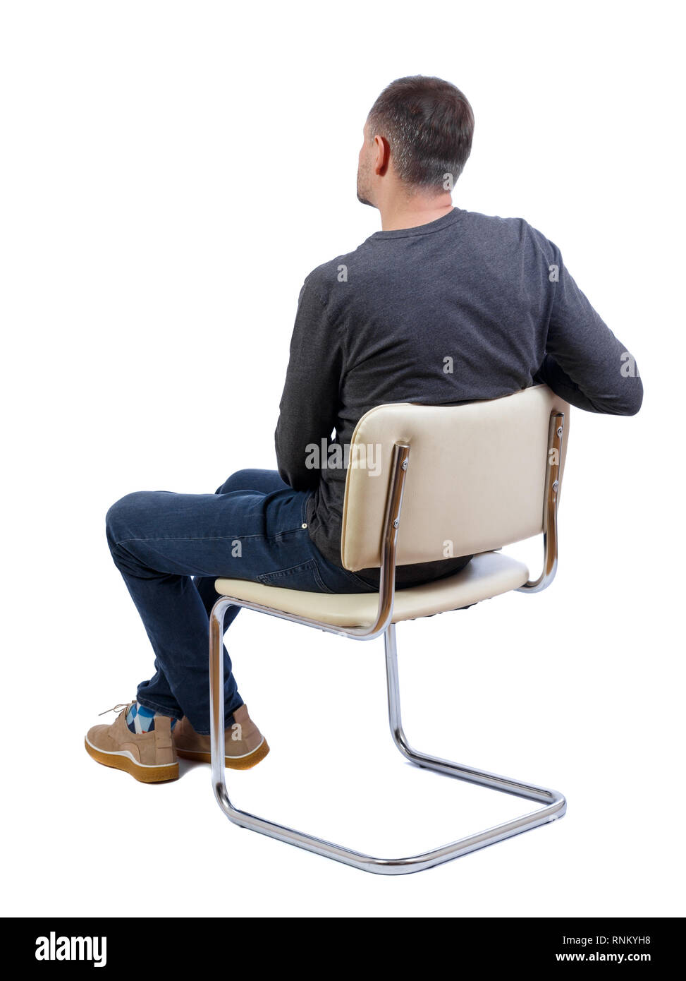 Side view of a man sitting on a chair. Rear view people collection ...
