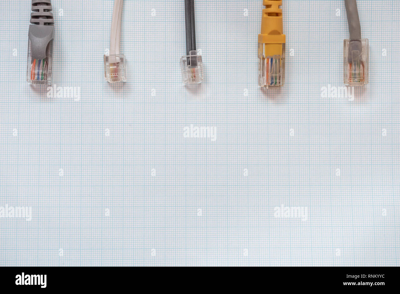 Network cables for connecting computers to the internet on a millimeter background Stock Photo