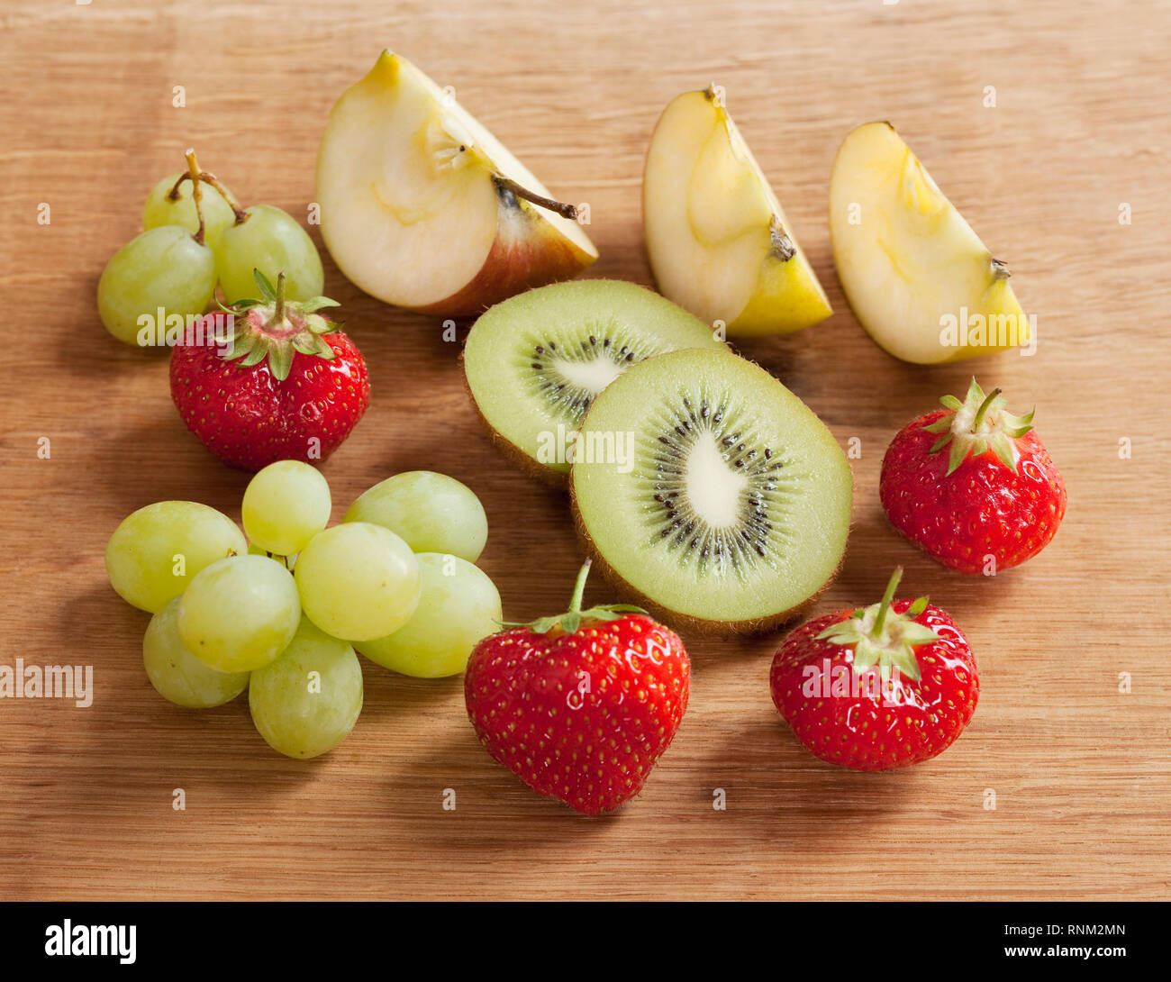 Fruit: Apple, green grapes, kiwi and strawberries. Stuido picture. Gremany. Stock Photo