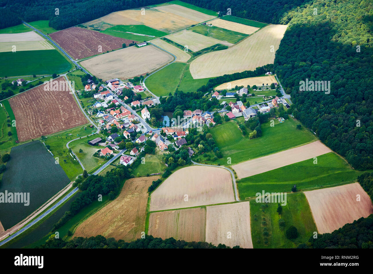 The town Fabrikschleichach seen from the air. Municipality Rauhenebrach, district of Hassberg, Bavaria, Germany Stock Photo