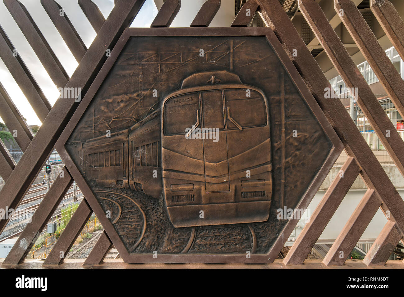 Engraving on metal representing a train on the Shimogoindenbashi Bridge that reaches the Nippori and Yanaka neighborhoods in the Arakawa district at t Stock Photo