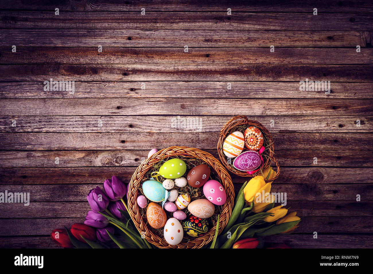 Spring holidays concept with easter eggs and tulips Stock Photo - Alamy