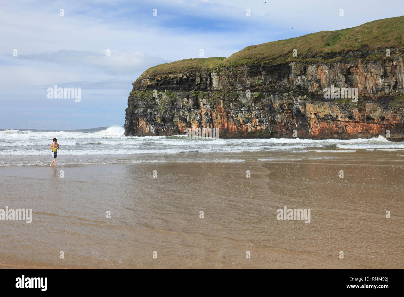steep sided rock cliffs dip into sea on wild atlantic way, county kerry, ireland Stock Photo