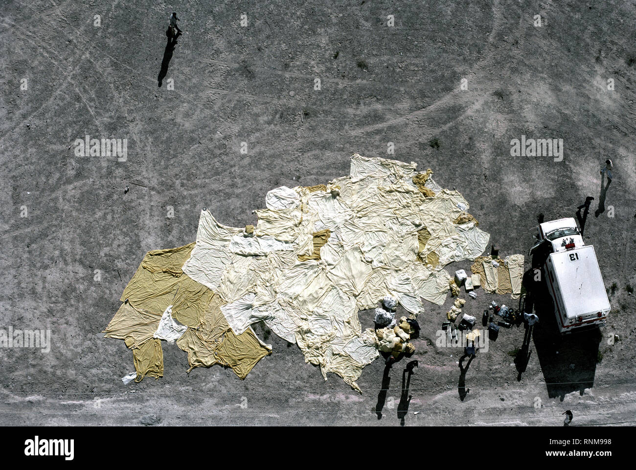 Aerial view of blankets and bed sheets used to cover the bodies of