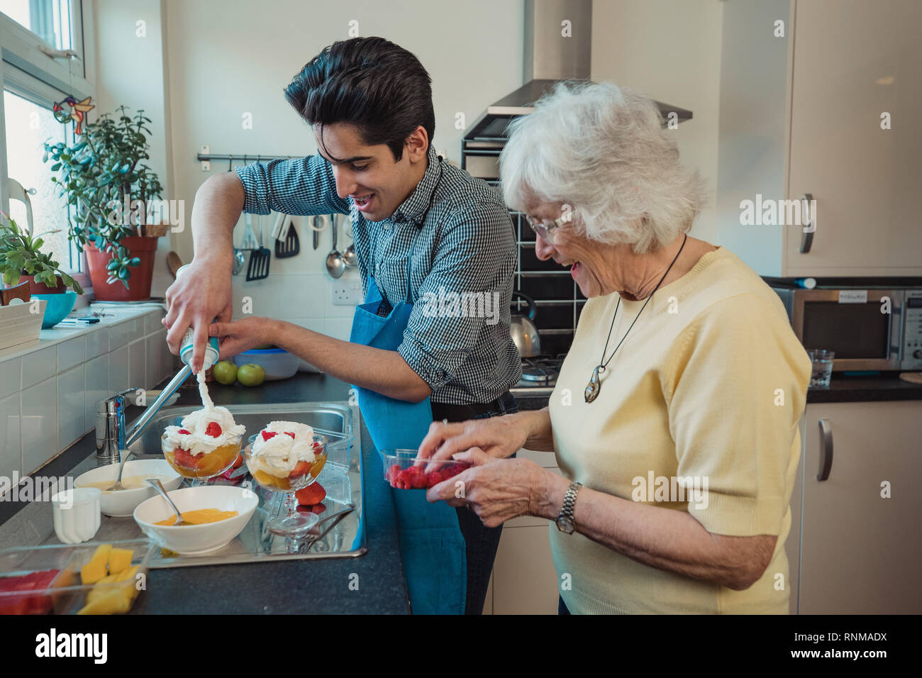 Boy eating mango hires stock photography and images Alamy