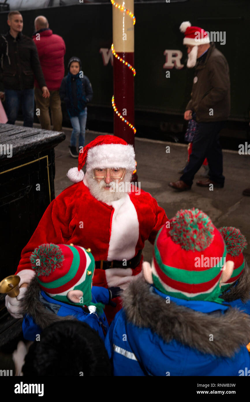 UK, England, Lancashire, Bury, Bolton Street Station of East Lancashire Railway, Santa Claus with children on platform Stock Photo