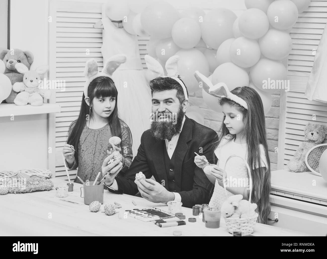 Easter, father and children in pink bunny ears. Stock Photo