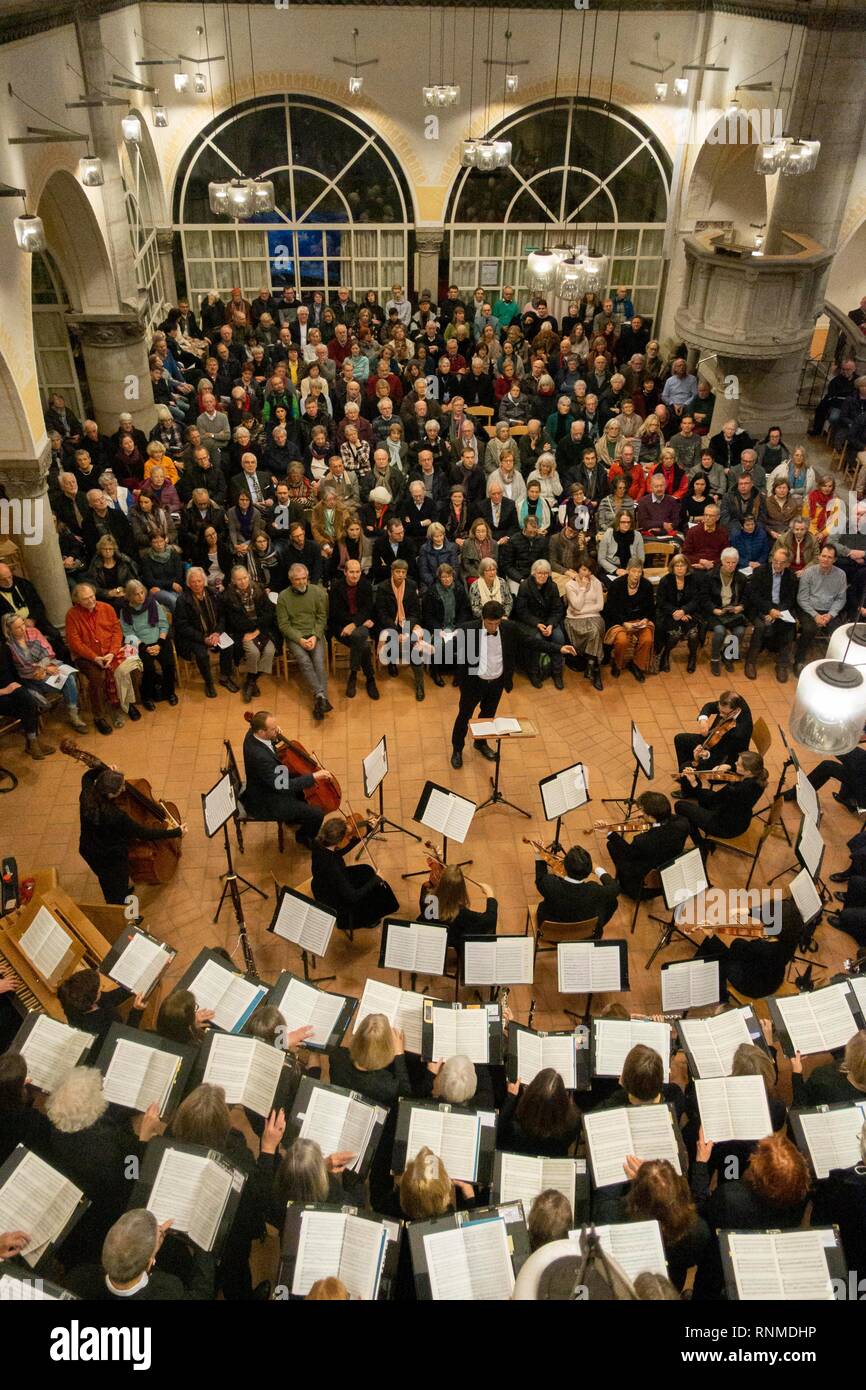Church choir and orchestra at a concert in a church, musician, conductor and audience, Evangelisch-Lutherische parish church St. Stock Photo