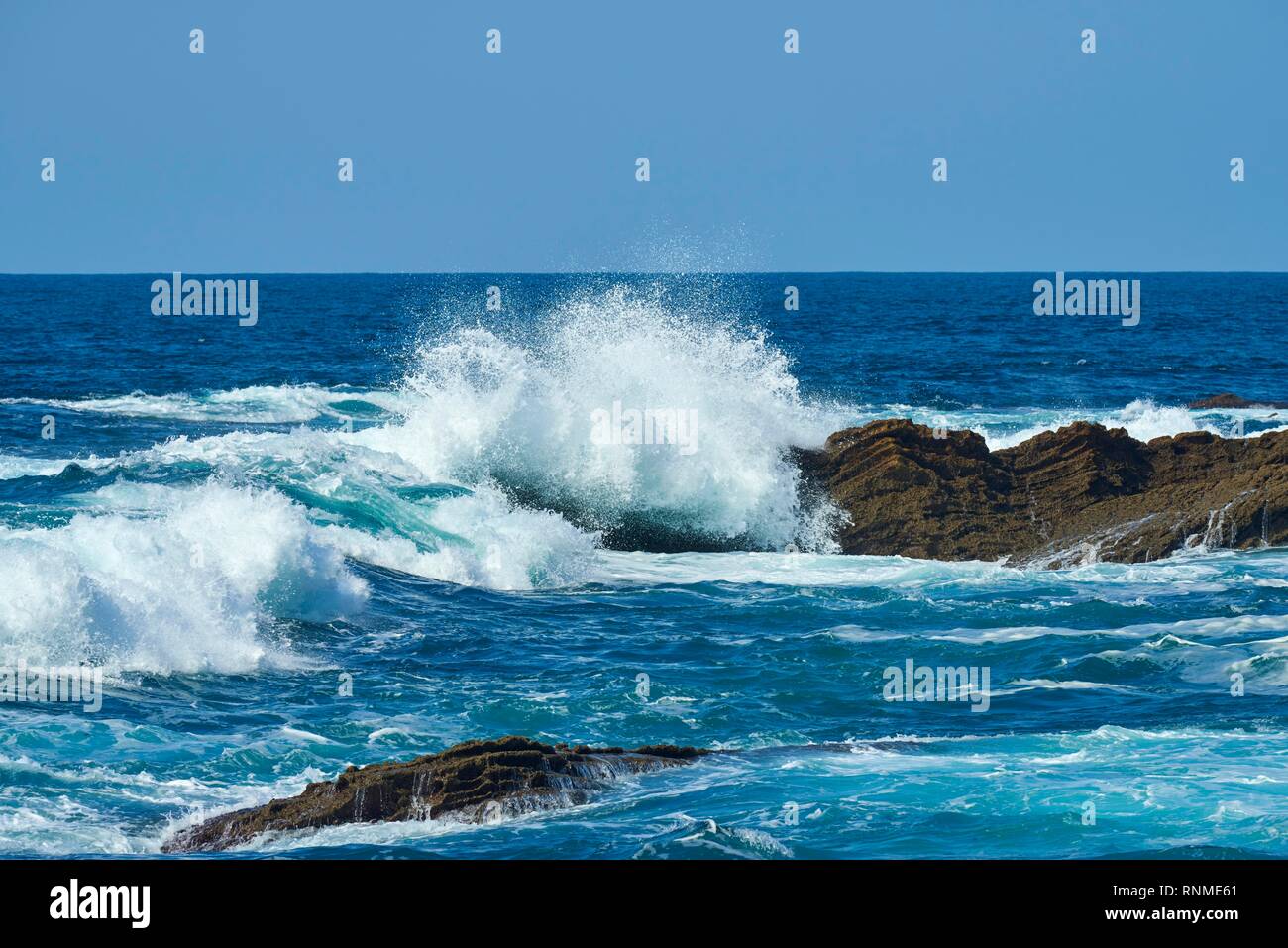 Breaking waves at rocky coast, atlantik ocean, near Hondarribia, Basque country, Spain Stock Photo
