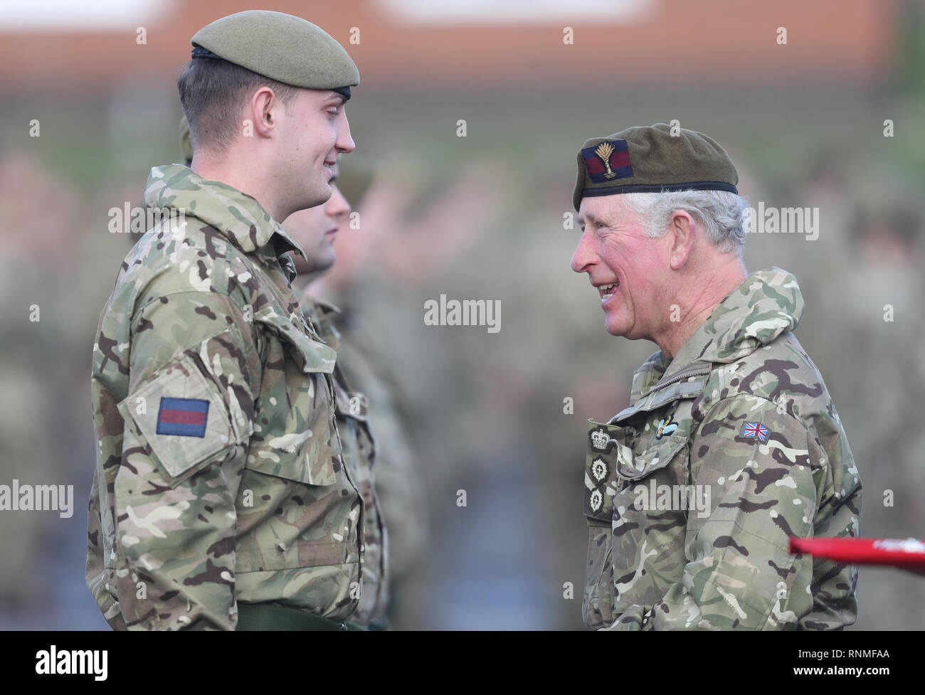 The Prince of Wales (right)talks with soldiers from the 1st Battalion ...