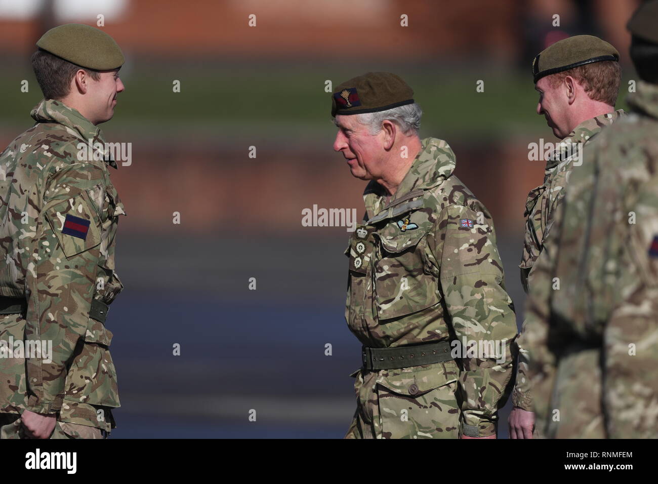 The Prince of Wales (centre) talks with soldiers from the 1st Battalion ...