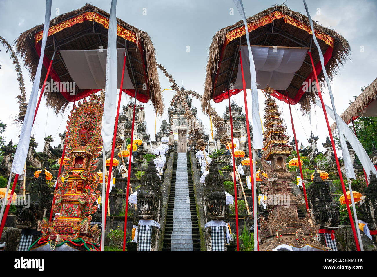 Pura Penetaran Agung Lempuyang Temple,  considered to be one of the 'six sanctuaries of the world'.  Temple portals framed by traditional Penjor poles Stock Photo