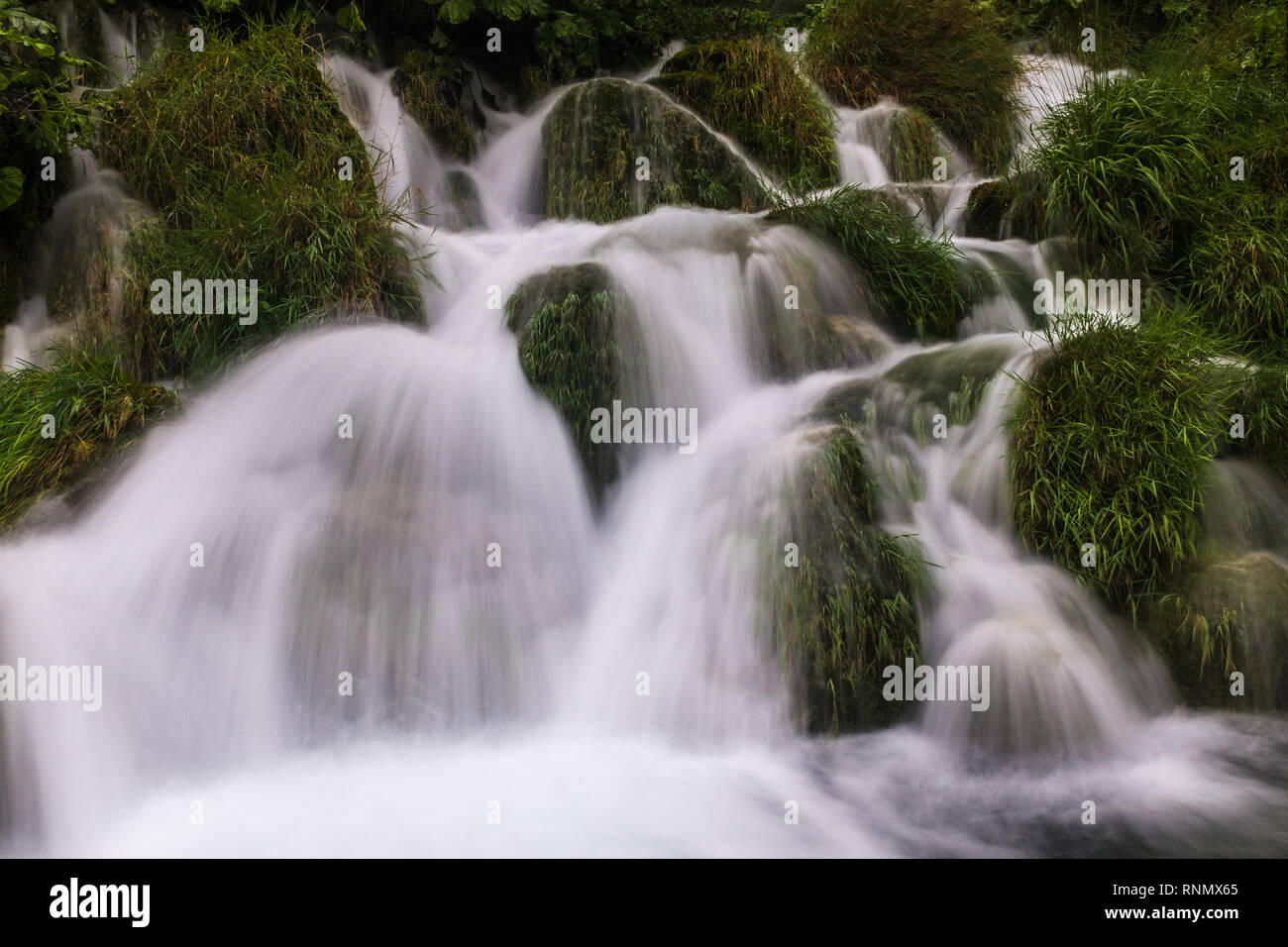 The beautiful and stunning Plitvice Lake National Park, Croatia, close up head on shot of a waterfall, slow shutter speed to smooth out the water Stock Photo