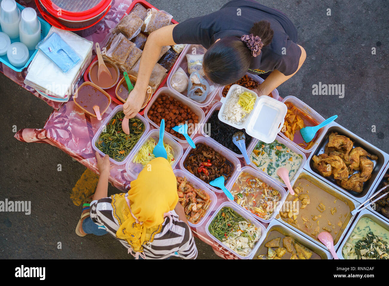 Kota Kinabalu Sabah Malaysia - Jun 17, 2016 : Street food vendor selling Malaysian home cooked dishes for breaking fast during month of Ramadhan at st Stock Photo