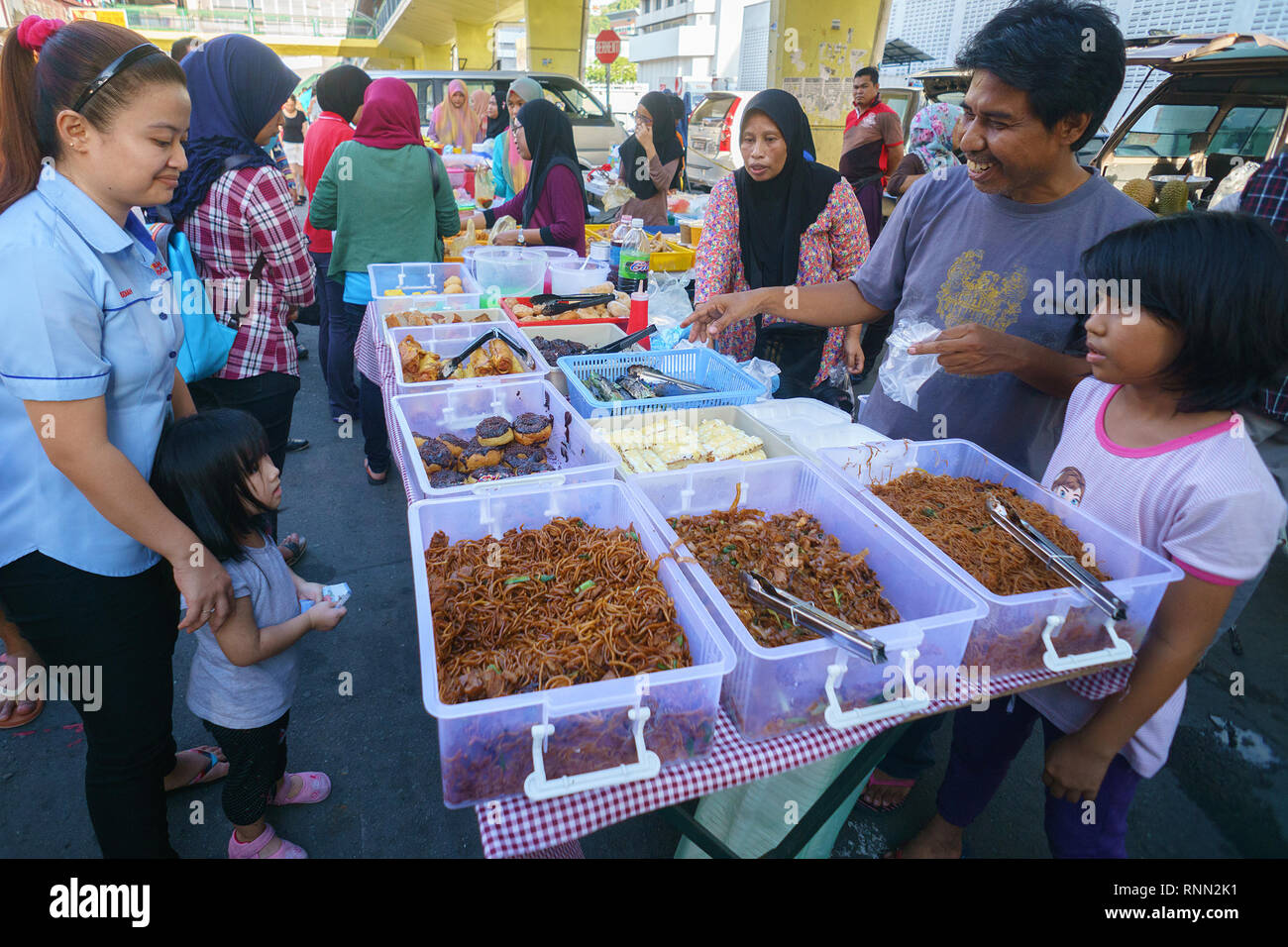 Kota Kinabalu Sabah Malaysia - Jun 8, 2016 : People visiting food bazar at Kota Kinabalu city buying food for breaking their fast during the Islamic m Stock Photo