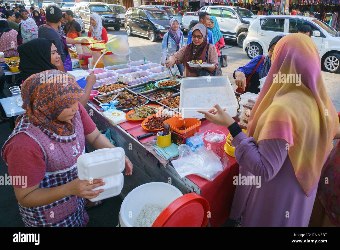 Kota Kinabalu Sabah Malaysia - Jun 8, 2016 : People visiting food bazar at Kota Kinabalu city buying food for breaking their fast during the Islamic m Stock Photo
