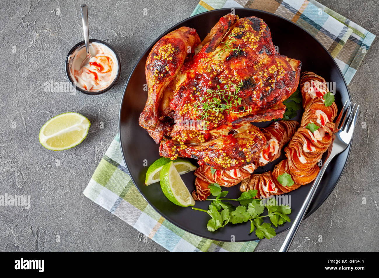 Roasted Chicken smothered with Tomato sauce and whole grain mustard served with hasselback sweet