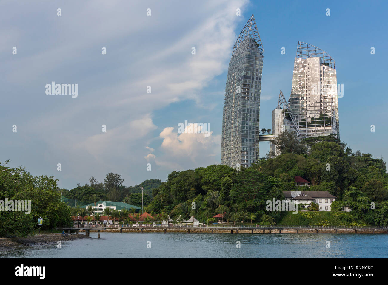 Singapore. Juxtaposition of Old and New: Daniel Libeskind's 'Reflections' in Background vs. Harbourmaster's 1920-era House in foreground on right.  Th Stock Photo