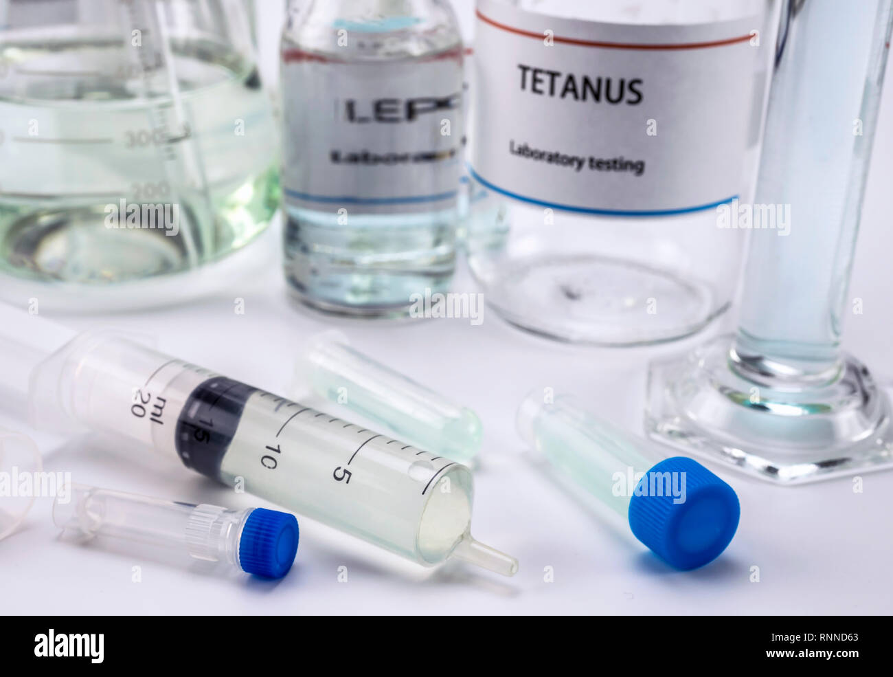 Test tetanus in laboratory, Syringe with medication for sampling, conceptual image, composition horizontal Stock Photo