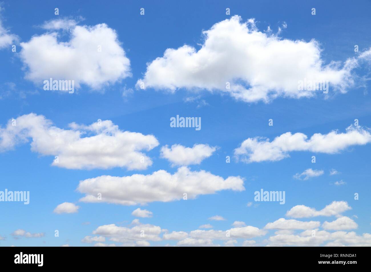 White fluffy clouds on blue sky. Idyllic background abstract Stock ...