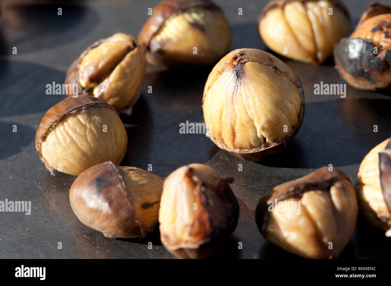 Italy, Lombardy, Roasted Chestnuts on a Street Pan Plate Ready for Sale Stock Photo