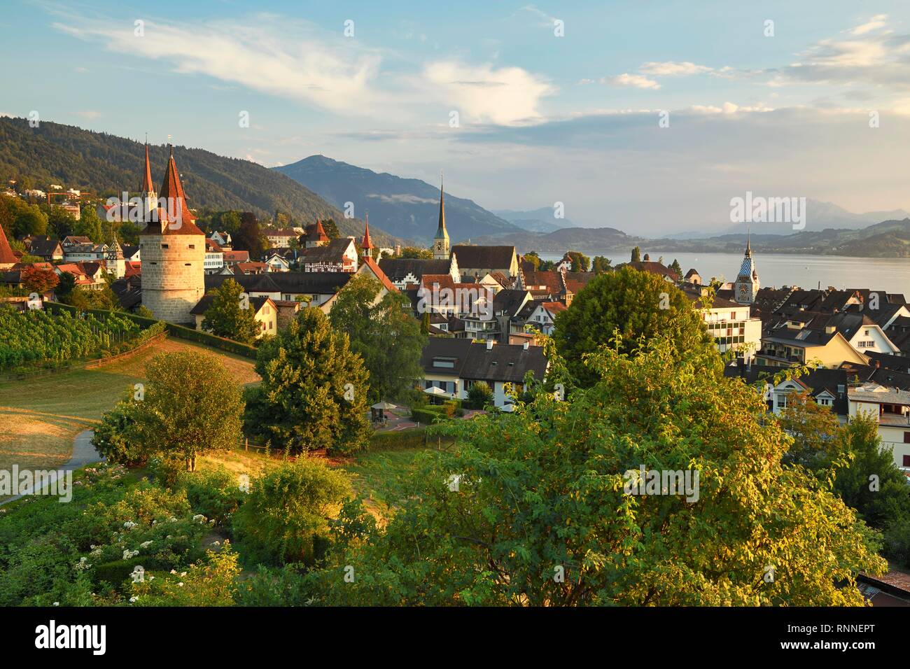 View from rose garden am Guggi to Zytturm, Capuchin tower and church, old town, Rigi at the back, Pilatus, Zug, Canton Zug Stock Photo