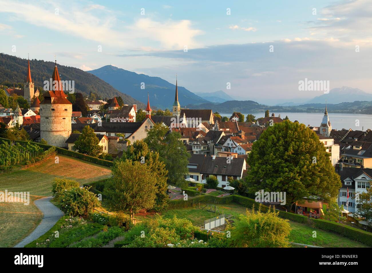 View from rose garden am Guggi to Zytturm, Capuchin tower and church, old town, Rigi at the back, Pilatus, Zug, Canton Zug Stock Photo