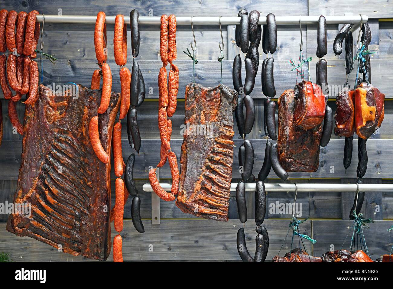 Black Forest sausage and meat specialities in one display, Berlin, Germany Stock Photo