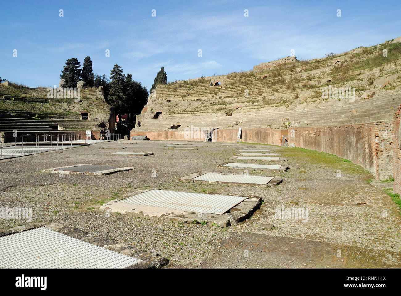 Pozzuoli, Campania, Italy. The cavea and the arena of the Pozzuoli Flavian Amphitheater. The amphitheater is the third largest after the Colosseum and the amphitheater of Santa Maria Capuavetere. It were used for events such as gladiator combats, venationes (animal hunts) and executions. Stock Photo