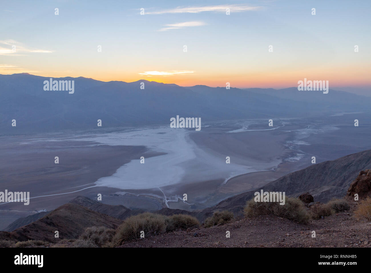 Sunset viewed over Death Valley (Badwater) towards the Panamint Range.  View from Dante's View, Death Valley National Park, California, United States. Stock Photo