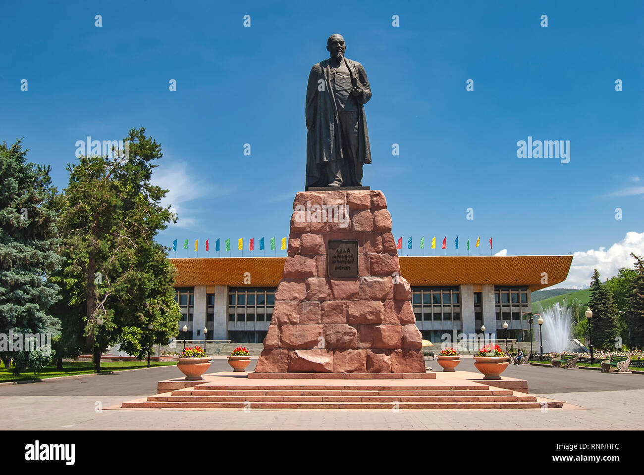 The statue of the poet Abai Qunanbaiuli in front of the Palace of the Republic, Almaty, Kazakhstan Stock Photo