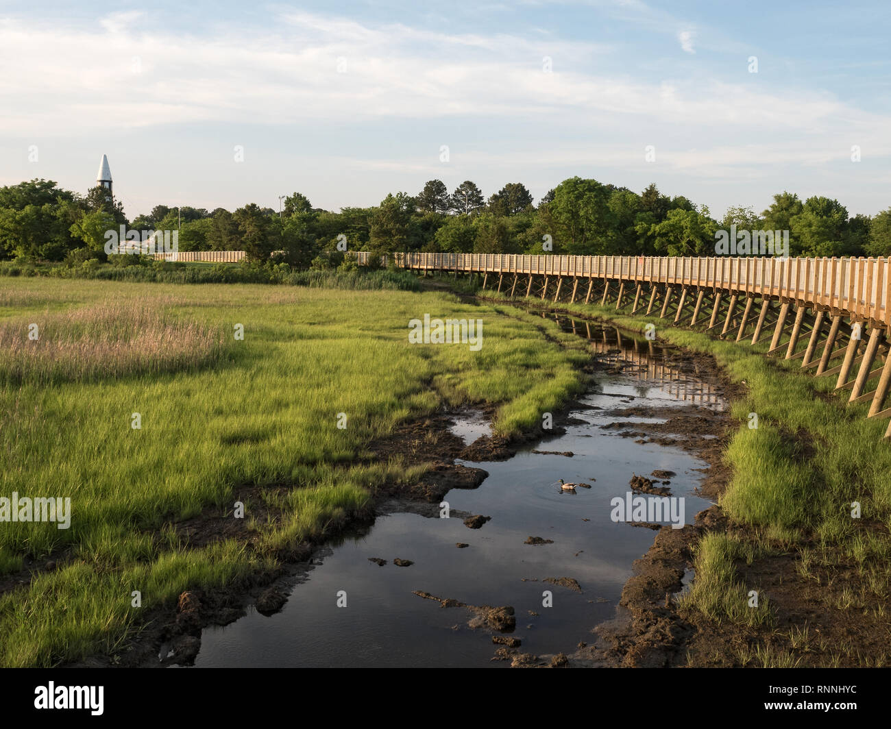 Newmarket Creek and marsh in Hampton, Virginia, showing boardwalk and Air Power Park in the distance. Stock Photo