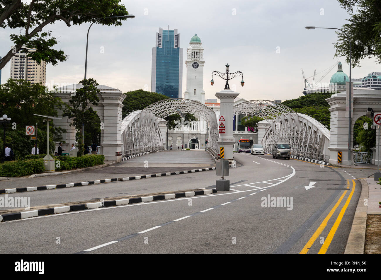 Anderson Bridge over Singapore River, Singapore.  Victoria Concert Hall in background. Stock Photo