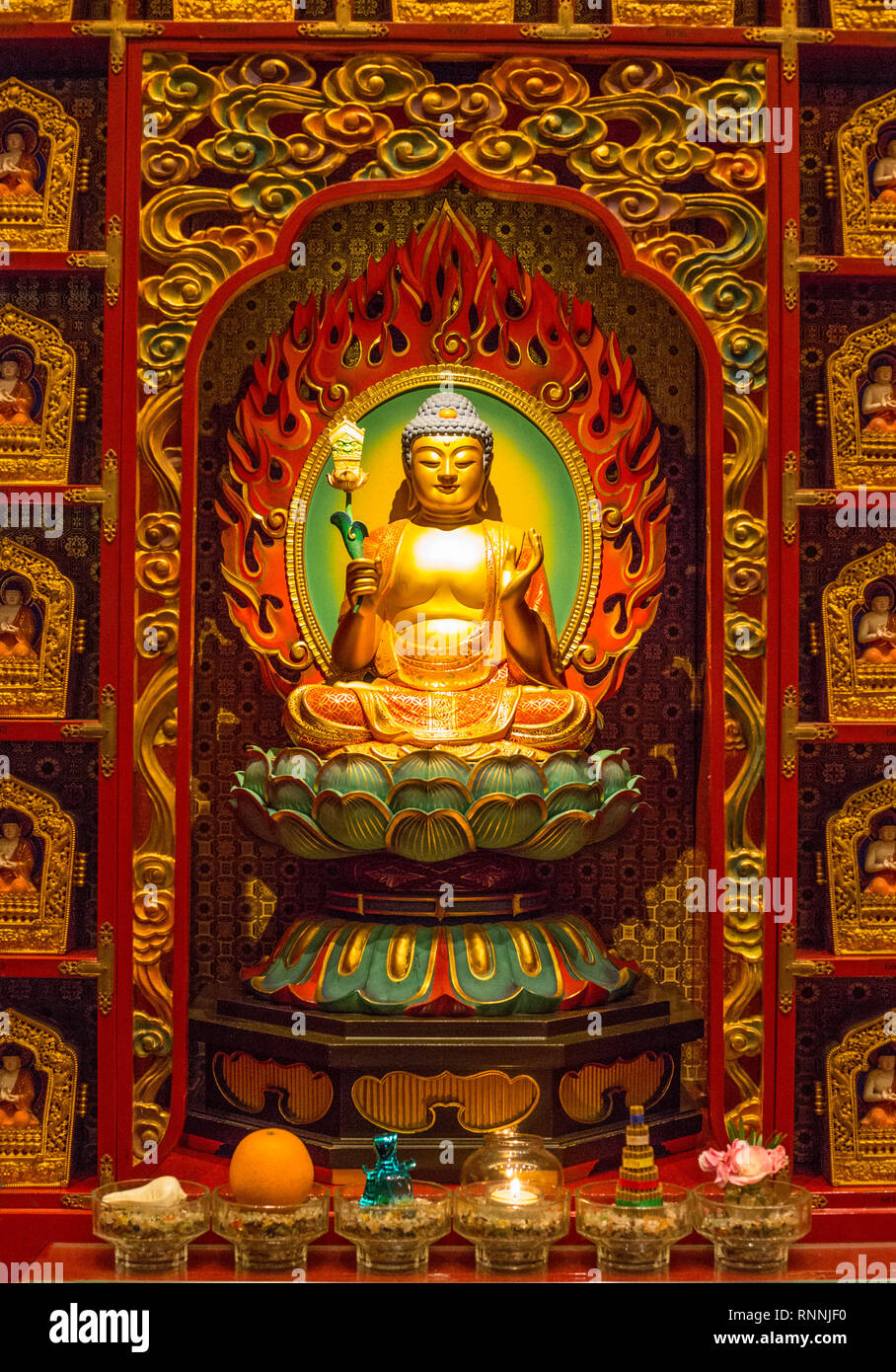 Buddha in Wall Niche Surrounding the Prayer Hall, Buddha Tooth Relic Temple, Singapore. Stock Photo