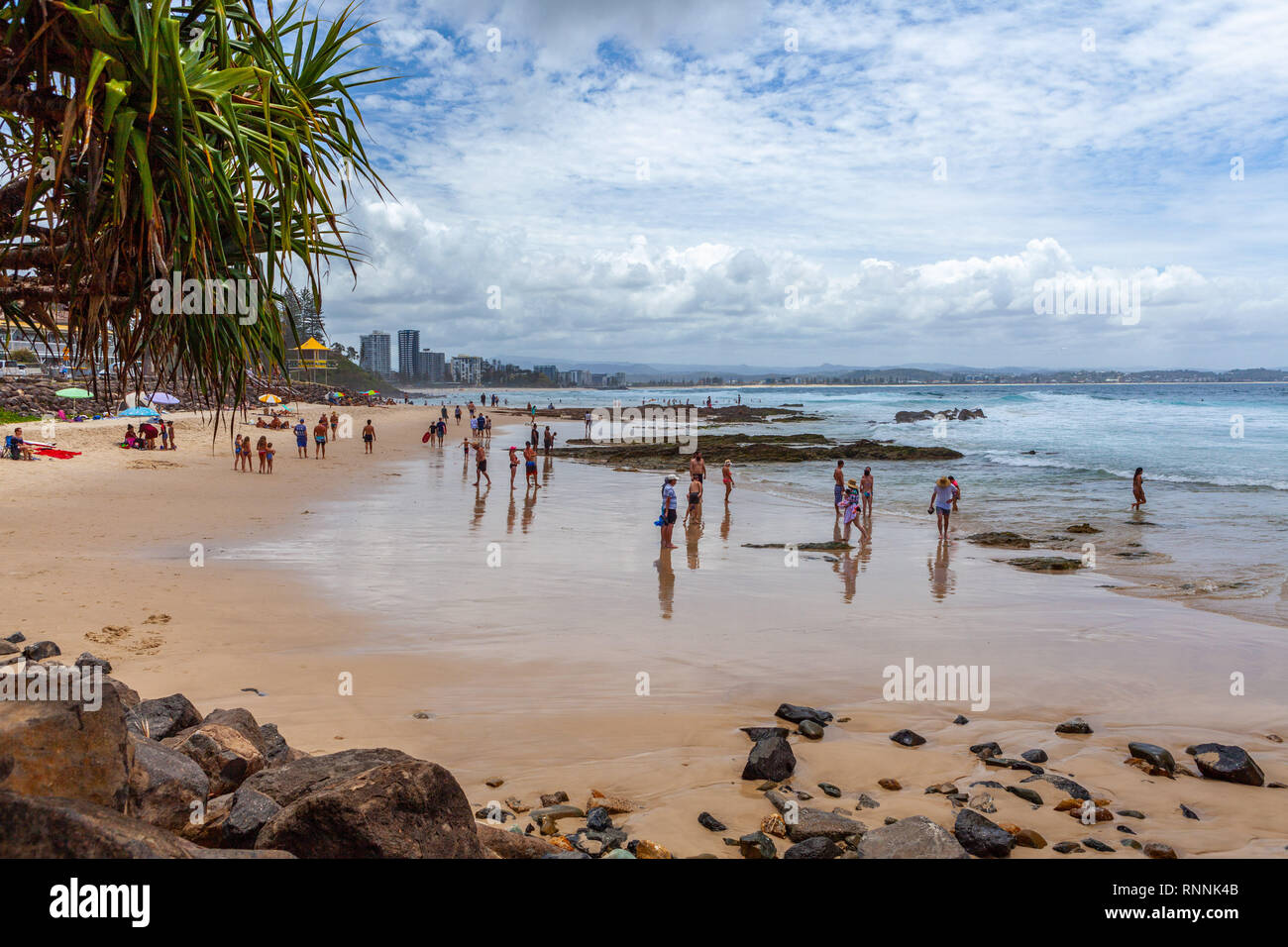 Coolangatta, Australia - January 6, 2019: People enjoying the summertime on Rainbow Bay beach. Coolangatta, NSW, Australia Stock Photo