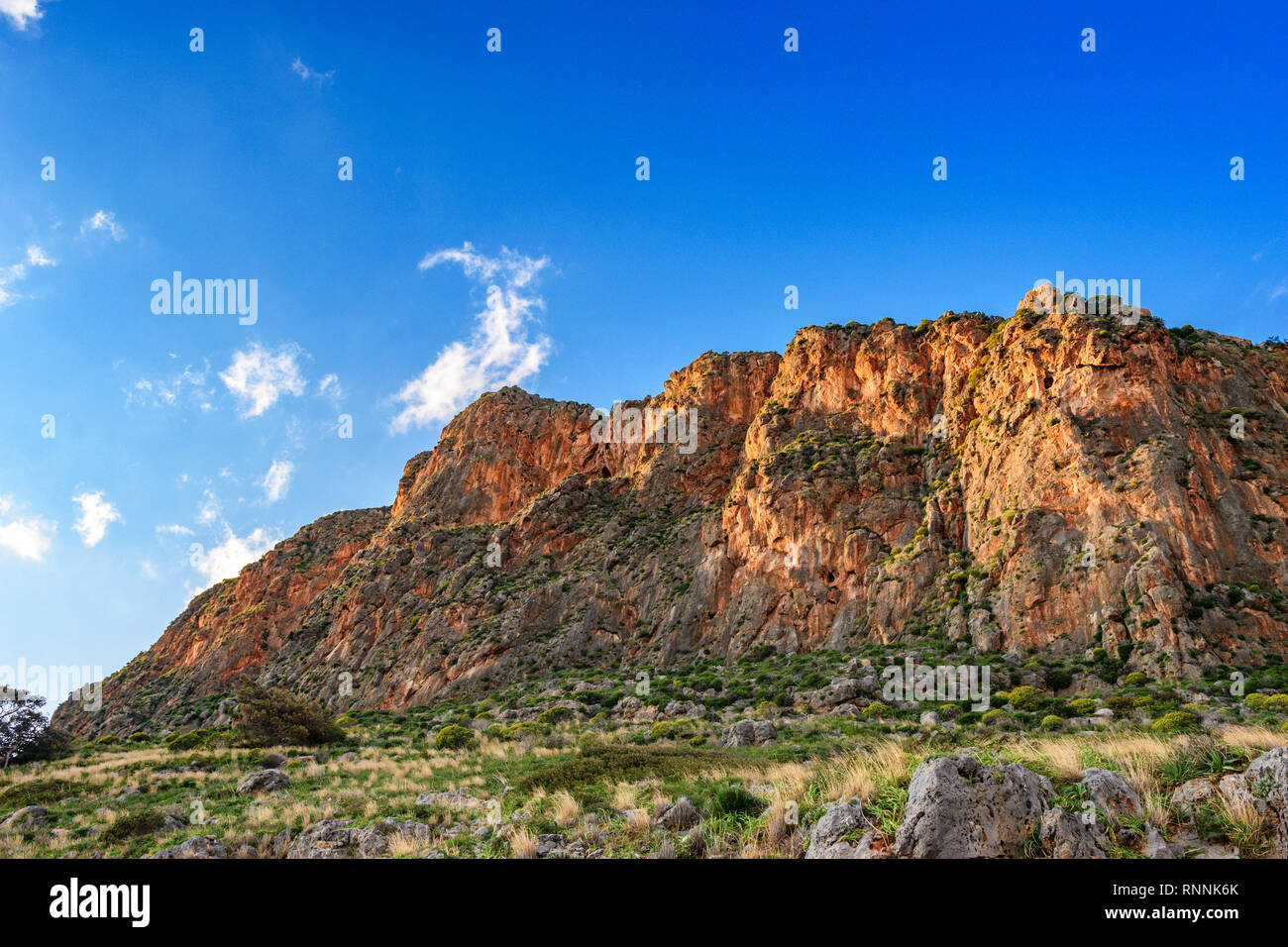 Impressive view of the Great Rock of Monemvasia island and the medieval 'castletown' in Laconia against a deep blye sky. Monemvasia. Stock Photo