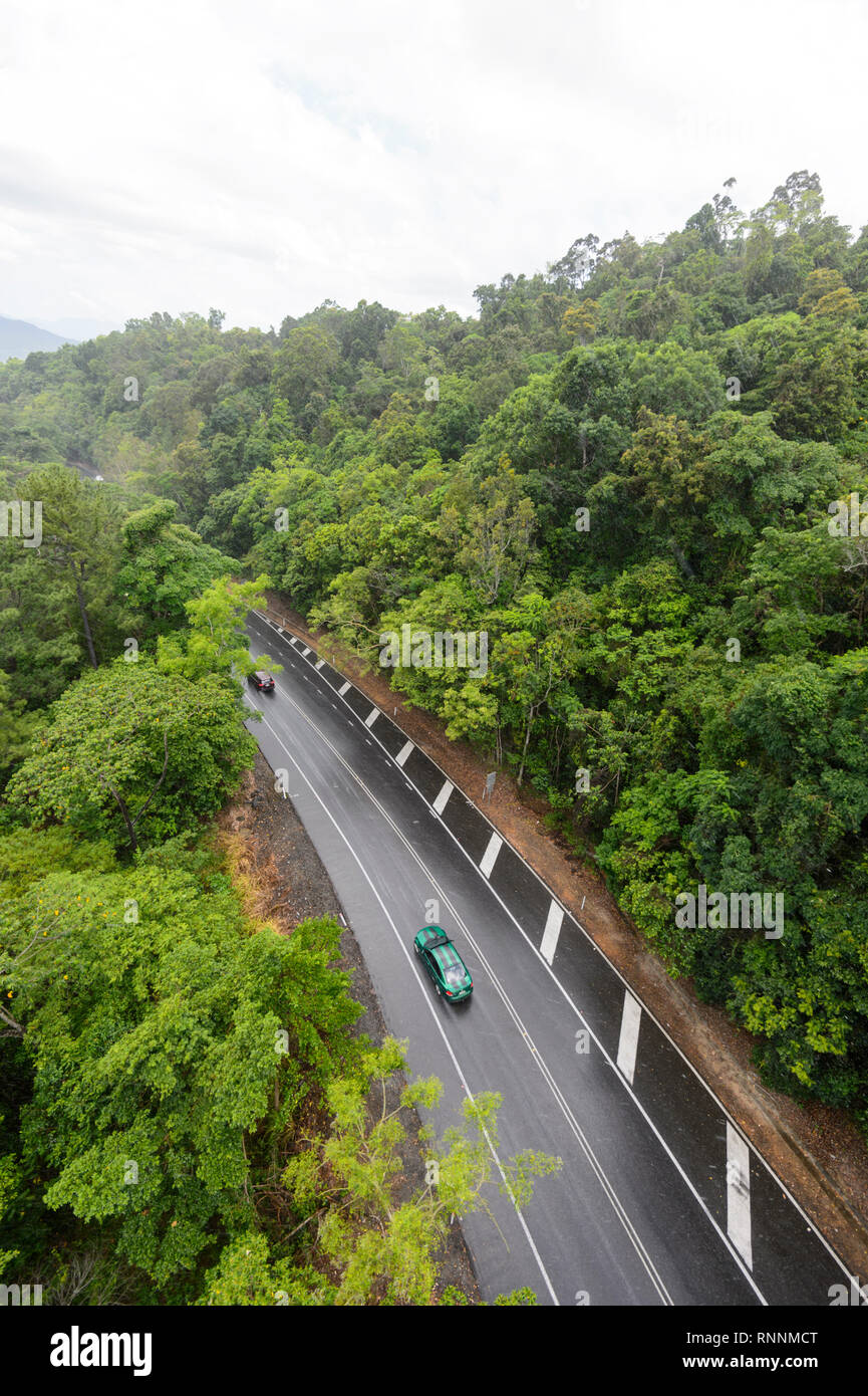 Aerial view of the road going over the Kuranda Range through tropical rainforest on a rainy day, Cairns, Far North Queensland, FNQ, QLD, Australia Stock Photo