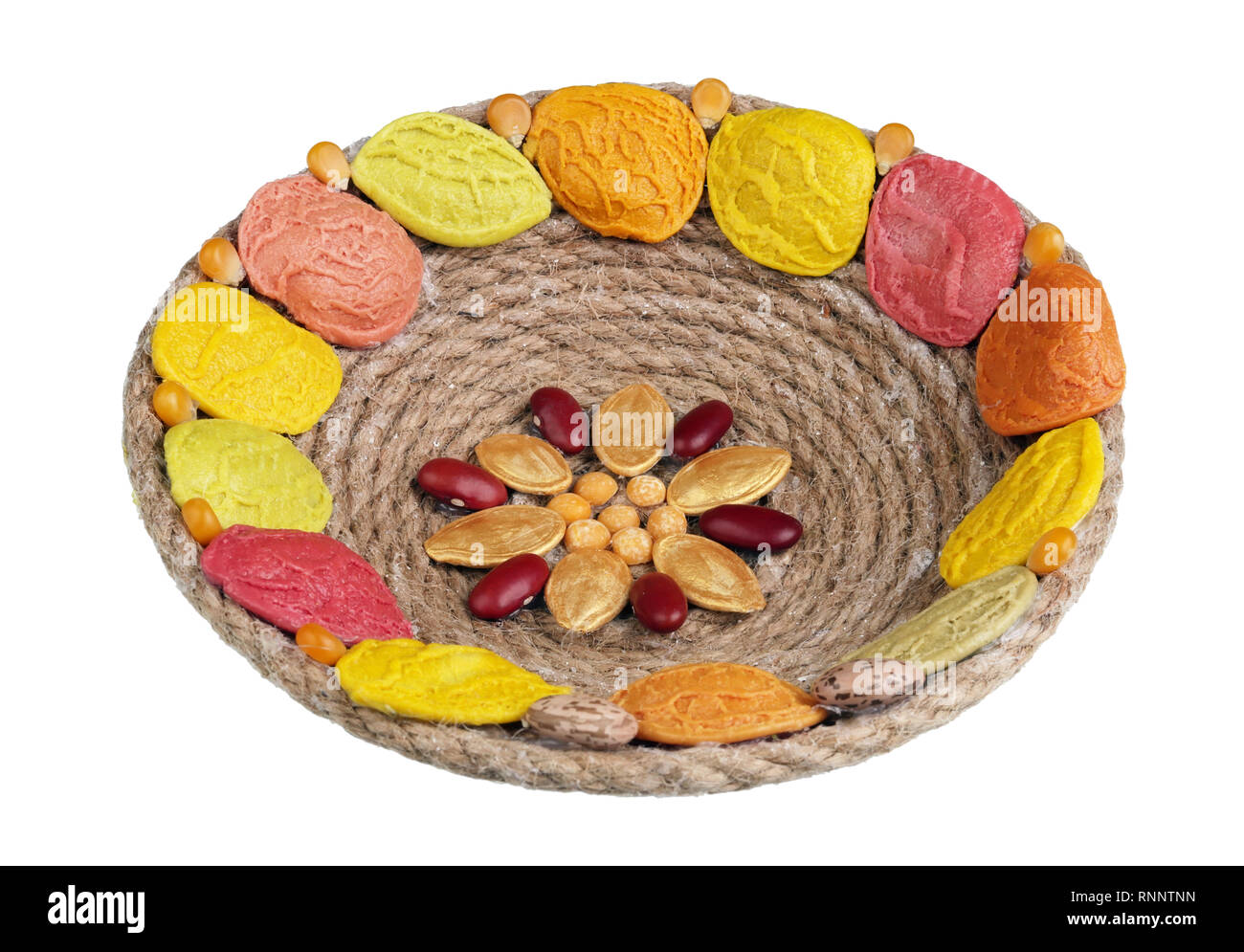 Easter handmade nest  made from  rope. past and vegetables seeds. Isolated on white macro Stock Photo
