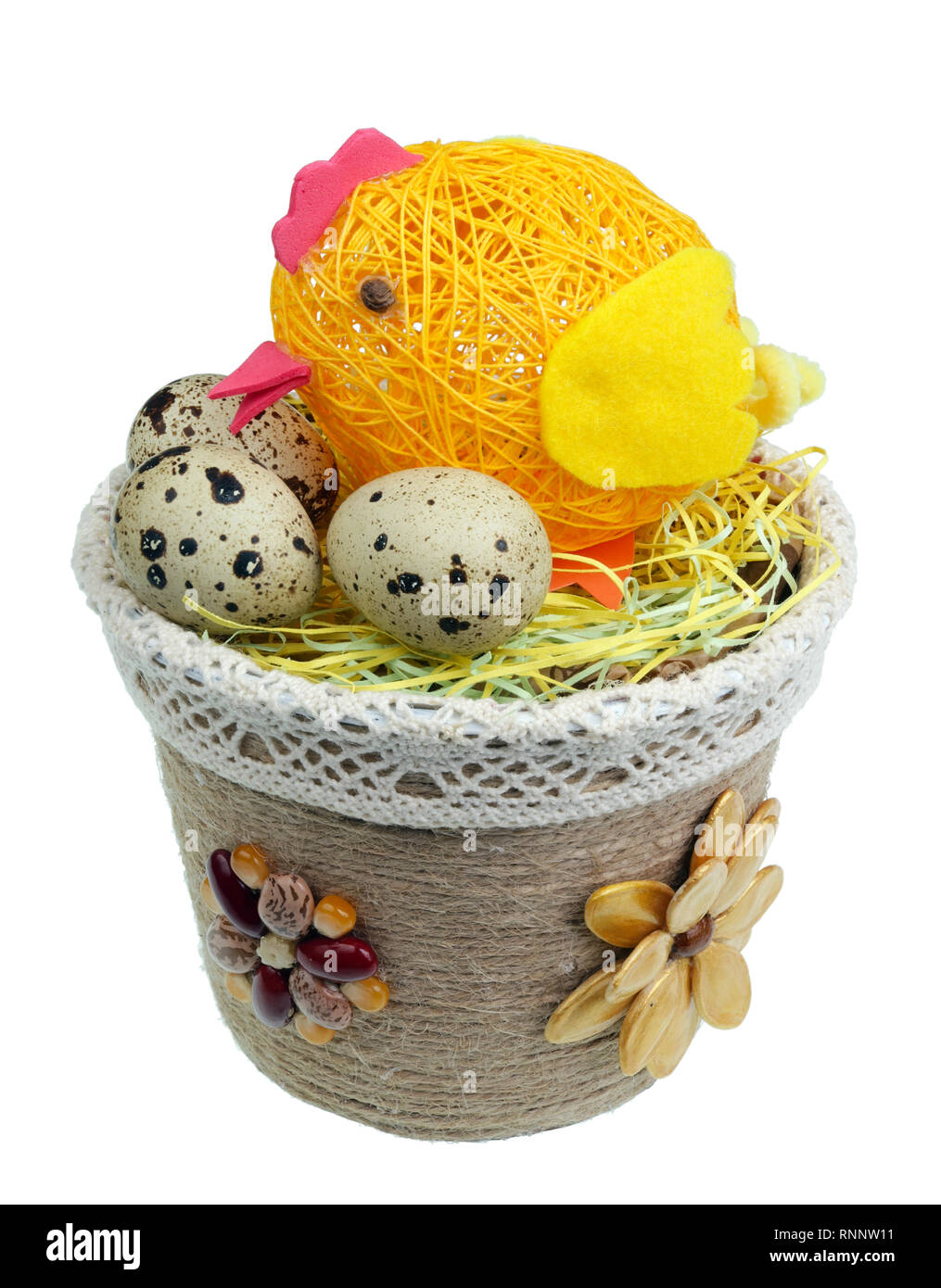 Easter  handmade  nest  from pope and seeds with funny yellow  chicken and guail  eggs. Isolated on white studio macro shot Stock Photo