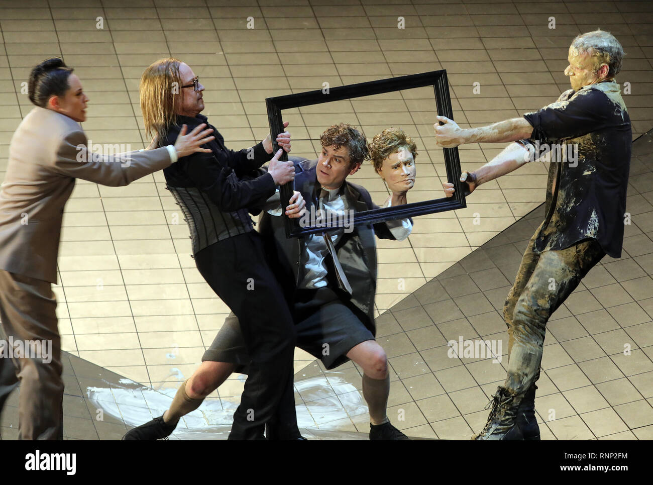 Berlin, Germany. 19th Feb, 2019. Annika Meier as Maria Bloch (l-r), Gerrit Jansen as Johannes Bloch, Owen Peter Read as the twins and Oliver Kraushaar as Simon are standing during the photo rehearsal of the play 'Kriegsbeute' by M. Behnke and B. Qurbani in the Berliner Ensemble on stage. The piece will be premiered on 22.02.2019. Credit: Wolfgang Kumm/dpa/Alamy Live News Stock Photo